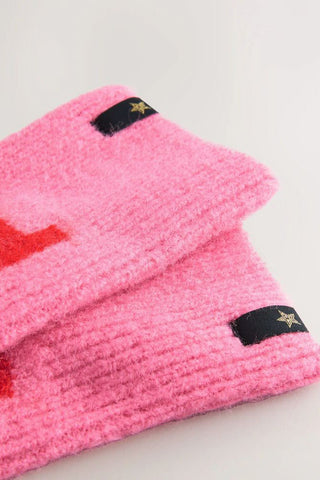 Close-up of the pink and red good times handwarmers, displayed laying on a white background.