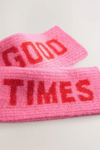 The pink and red good times handwarmers styled laid together on a white background.