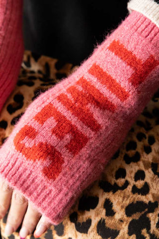 Close-up of the Pink & Red Good Times Handwarmers worn by a model.