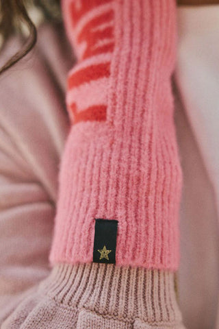 Close-up of the design and star detail of the pink and red good times handwarmers.