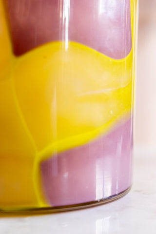 the yellow detailing on the Pink & Yellow Abstract Glass Vase. 