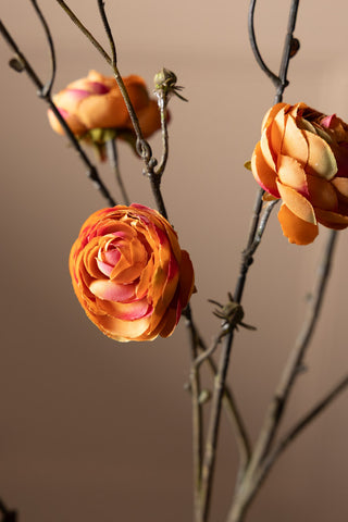 Close-up image of the Pretty Faux Ranunculous Stem in Blood Orange