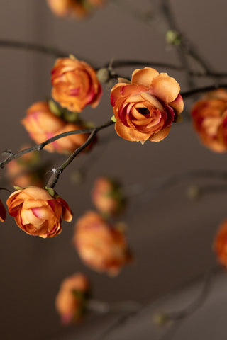 Close-up detail image of the Pretty Faux Ranunculous Stem in Blood Orange