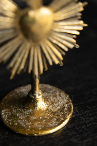 Image of the base on the Pretty Gold Milagro Heart Candle Holder