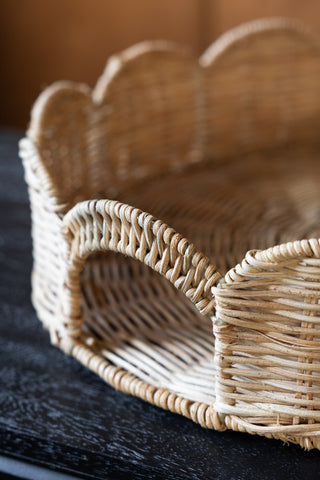 Image of the handle on the Pretty Round Rattan Scalloped Tray