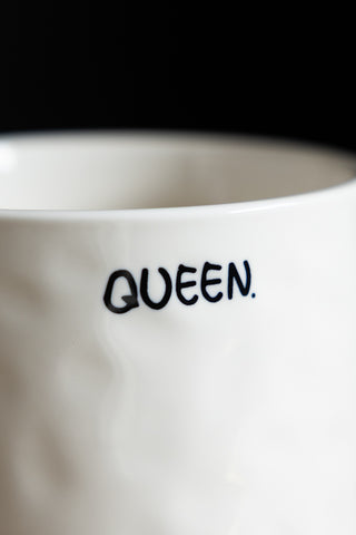 Image of the text on the Queen Mug