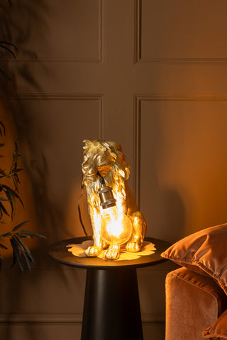 Lifestyle image of Quirky Gold Lion Lamp, displayed switched on