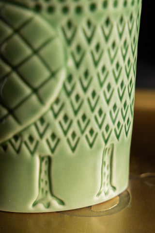 Close-up of the design on the Quirky Green Owl Bud Vase.