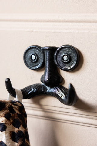 Lifestyle image of the Quirky Moustache Cast Iron Coat Hook
