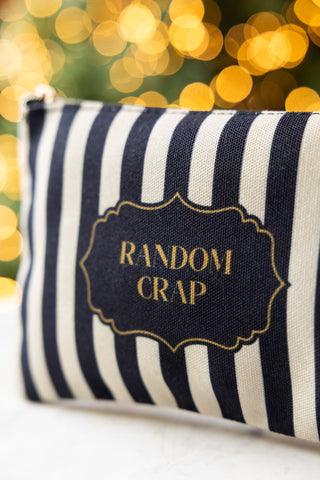 Close up detail of the Random Crap Striped Canvas Pouch. 
