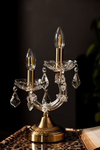 The Rechargeable Ornate Branch Table Lamp displayed on a leopard print surface.