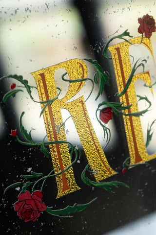 Close-up of the text and floral design on the Really Can't Be Arsed Wall Mirror.