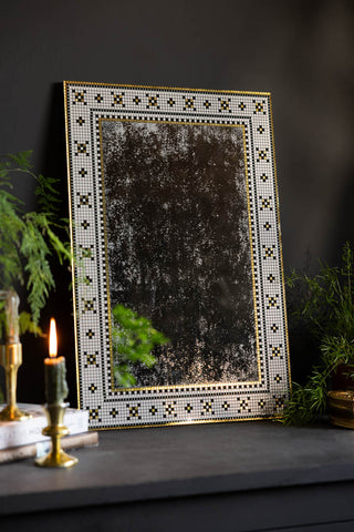 The Stunning Mosaic Tile Wall Mirror shown against a black wall and sideboard. 