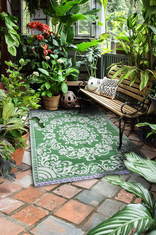 Lifestyle image of the Recycled Plastic Garden Rug In Green
