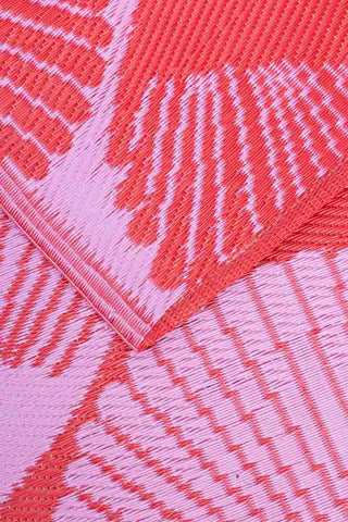 Close-up image of the Recycled Plastic Garden Rug In Pink & Red