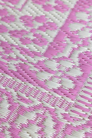 Close-up image of the Recycled Plastic Garden Rug In Pink