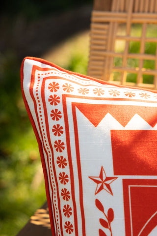 Close-up of the corner of the Red Cha Cha Cha Outdoor Cushion.