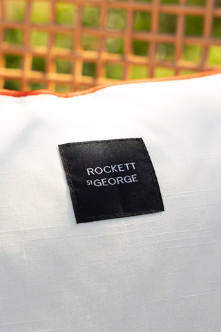 Close-up of the Rockett St George logo on the reverse side of the Red Cha Cha Cha Outdoor Cushion.