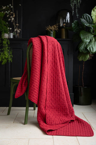 Lifestyle image of the Red Cross-Stitch Cotton Quilt