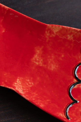 Close-up of the surface of the Red Fish Serving Dish.