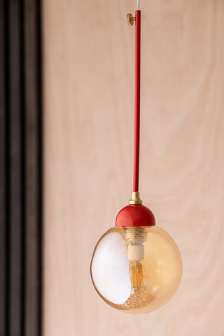 Lifestyle image of the Red Glass Dome Metal Ceiling Light