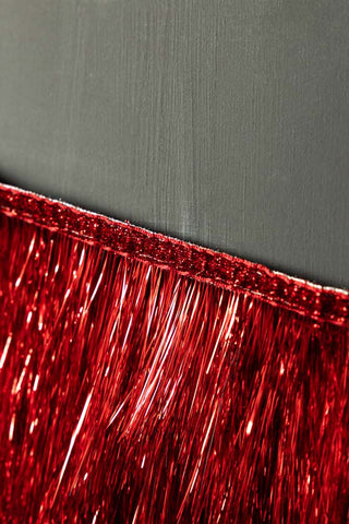 Close-up of the edge of the Red Scalloped Tinsel Garland.