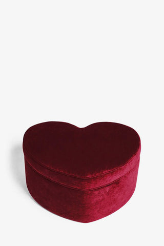 The Red Velvet Heart Footstool With Storage seen on a white background.