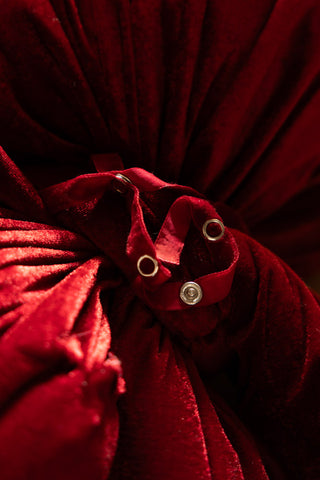 Close-up of the fastenings on the Red Velvet Oversized Bow Decoration.