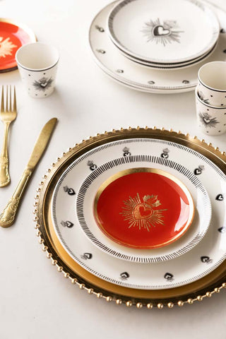 Image of the Red & Gold Milagro Heart Decorative Wall Plate on a table