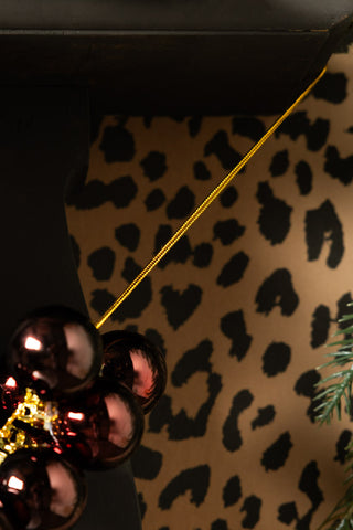 Close-up of the string on the end of the Red Antique-Effect Bauble Christmas Garland.