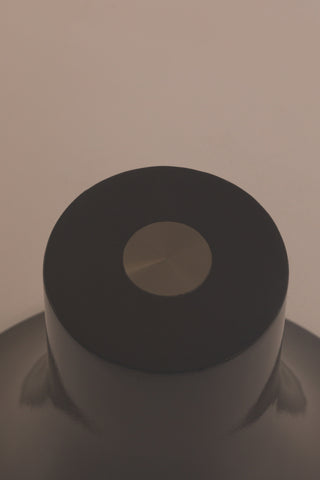 Close-up of the glass/base of the Retro Asymmetric Side Table in Espresso.