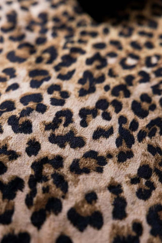 The leopard print pattern on the Signature Leopard Print Velvet Throw with Tassels