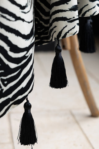Close-up of the tassels on the Zebra Print Velvet Throw with Tassels.