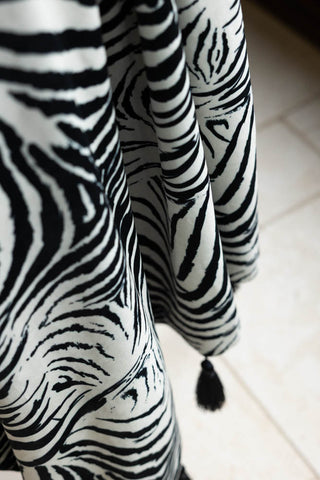 Close-up of the Zebra Print Velvet Throw with Tassels.