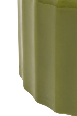 Close-up of the side of the Ribbed Edge Round Side Table in Green Glaze on a white background.