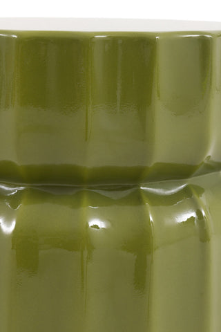 Close-up of the middle of the Ribbed Edge Round Side Table in Green Glaze on a white background.
