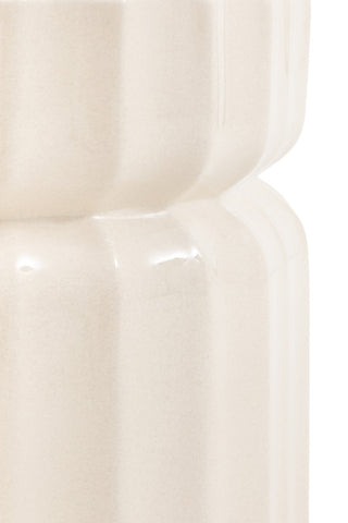 Close-up of the middle of the Ribbed Edge Round Side Table in Ivory Glaze in front of a white background.