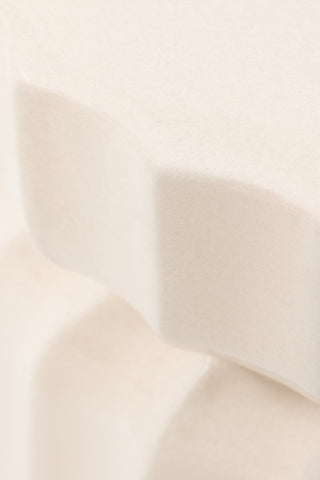 Close-up of the edge of the Ribbed Edge Round Side Table in Ivory Glaze.