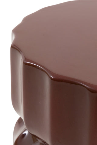 Close-up of the top of the Ribbed Edge Round Side Table in Rust Glaze on a white background.