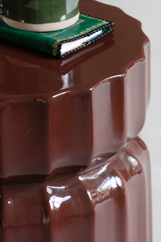 Close-up of the top of the Ribbed Edge Round Side Table in Rust Glaze.