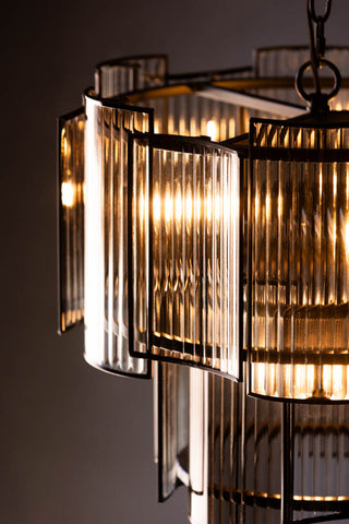 Close up detail of the glass panels on the Ribbed Glass Loft Chandelier. 