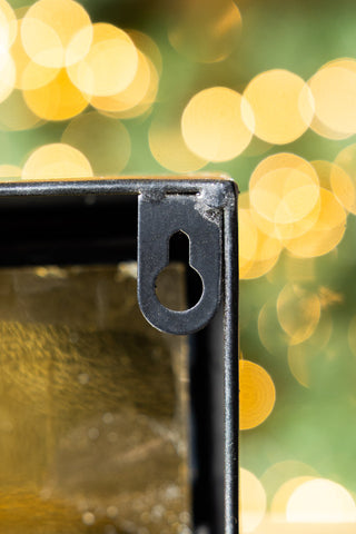 The fixing on the back of the Ring For Refills Gold Wall Ornament. 
