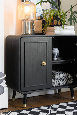 Close-up of the Black & Gold Ringo Small Sideboard with one door open.