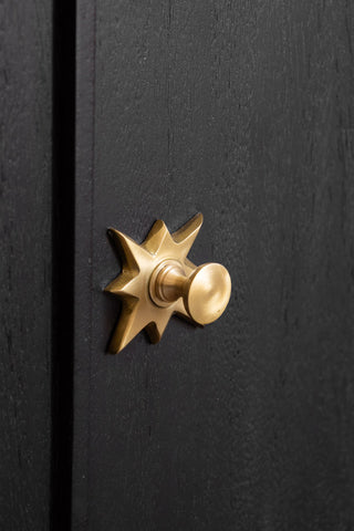 Close-up of the handle of the Black & Gold Ringo Small Sideboard.