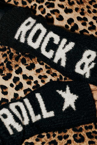 Close up of the Rock & Roll Handwarmers on a leopard velvet background. 