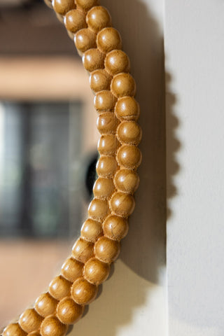 The side of the Round Bobbin Frame Mirror, showing the bobbin detailing. 