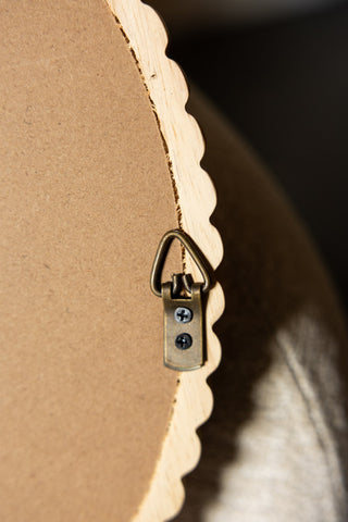 the hanging fixture on the back of the Round Bobbin Frame Mirror. 