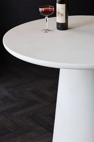 Close-up image of the Round Indoor/Outdoor Dining Table In Off-White