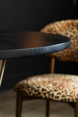 Close-up image of the Round Striped Wood Dining Table