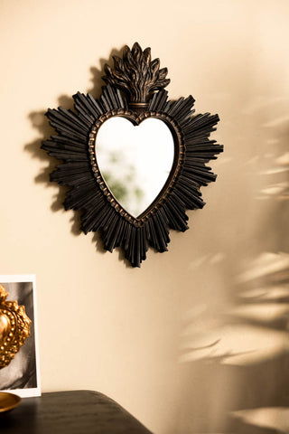 Lifestyle image of the Sacred Heart Black Frame Decorative Mirror